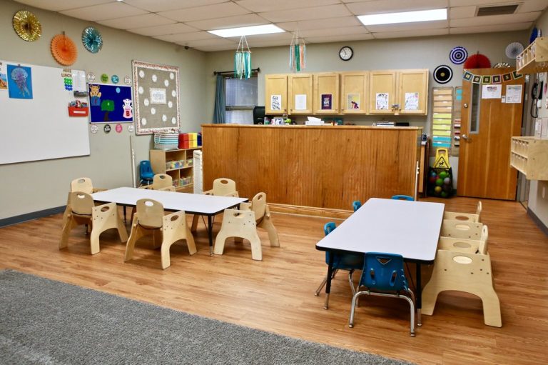 Bright toddler classroom at Ardent Trace Crossings with tables and chairs for early learners